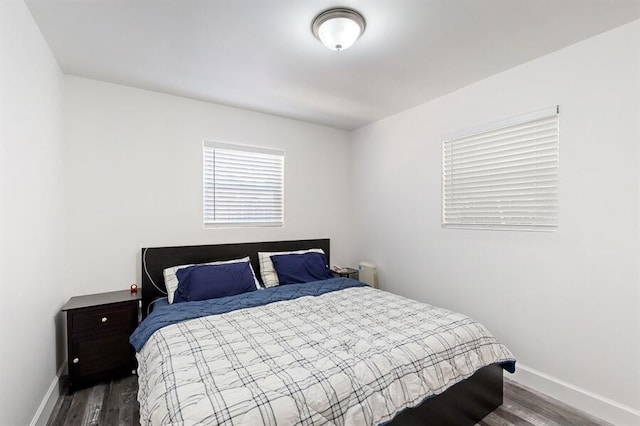 bedroom featuring dark hardwood / wood-style flooring