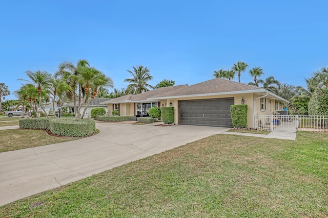 ranch-style house featuring a garage and a front yard