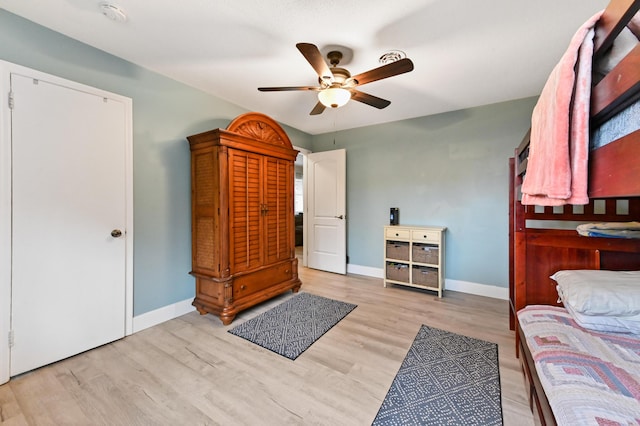 bedroom featuring light hardwood / wood-style floors and ceiling fan