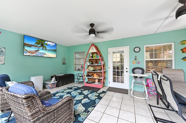 tiled living room with ceiling fan