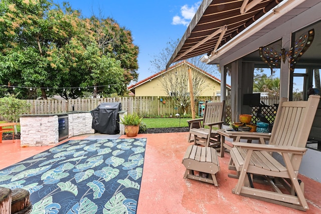 view of patio featuring grilling area and exterior kitchen