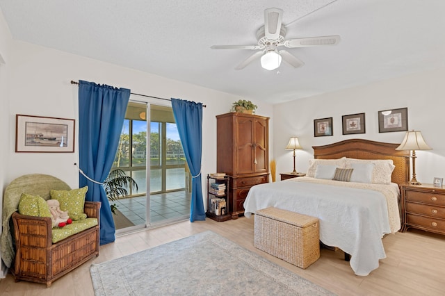 bedroom with access to outside, ceiling fan, and light hardwood / wood-style floors