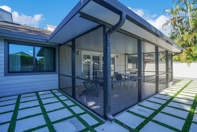 exterior space featuring a sunroom and a patio