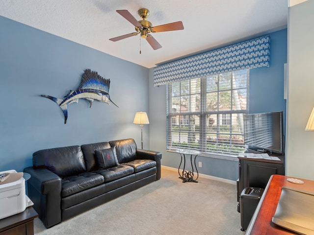 living room with ceiling fan and carpet floors