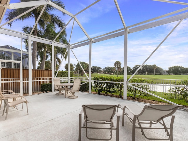 unfurnished sunroom featuring a healthy amount of sunlight and a water view