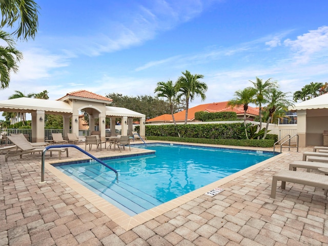 view of swimming pool with a patio area