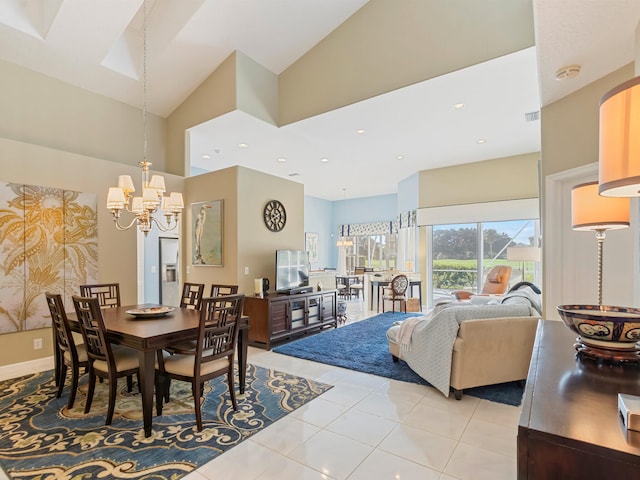 tiled dining space with high vaulted ceiling and an inviting chandelier