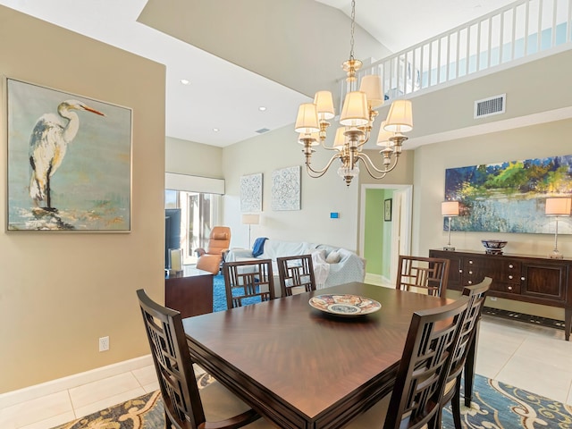 tiled dining area featuring a chandelier