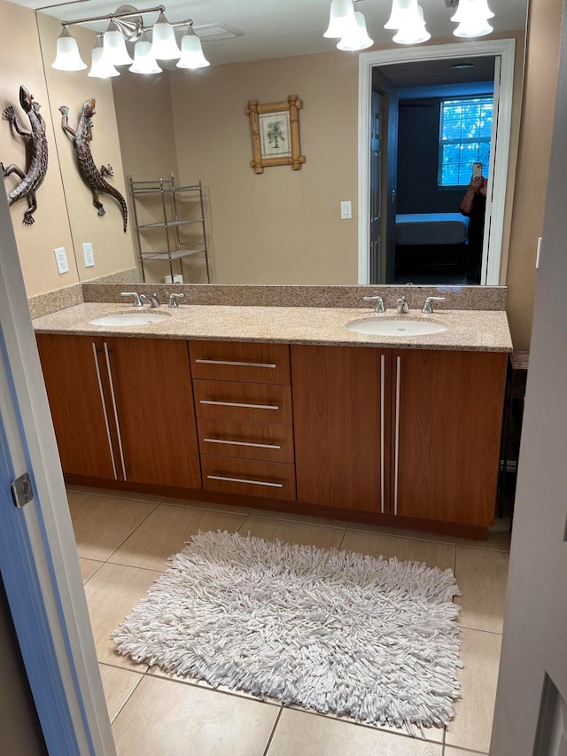 bathroom featuring tile patterned flooring and vanity