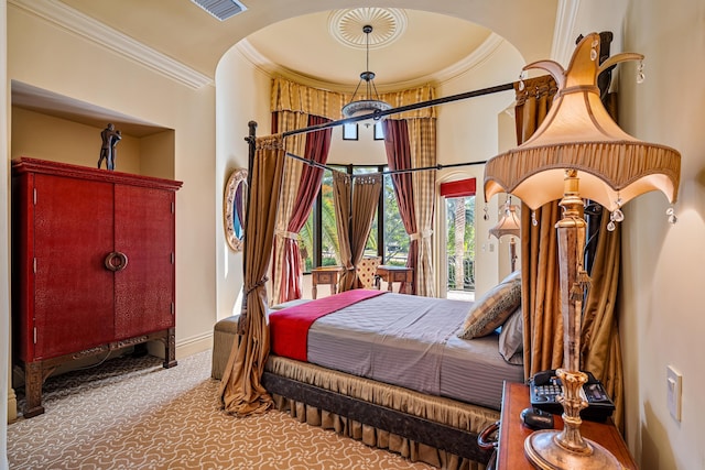 carpeted bedroom with ornamental molding