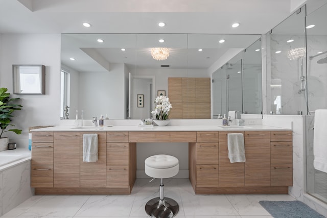 bathroom featuring vanity and shower with separate bathtub