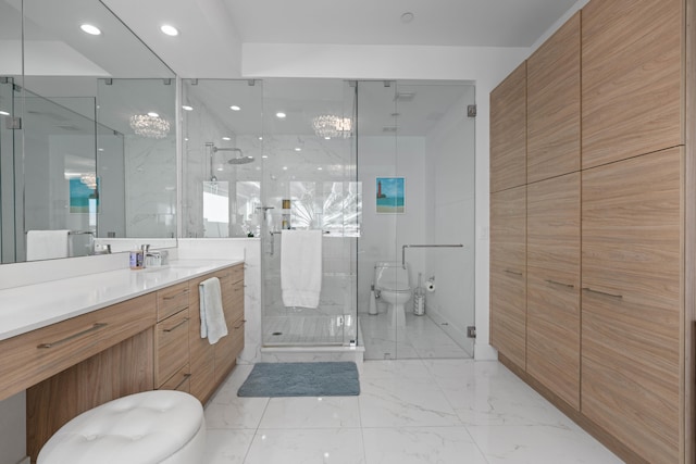 bathroom with vanity, toilet, and an enclosed shower