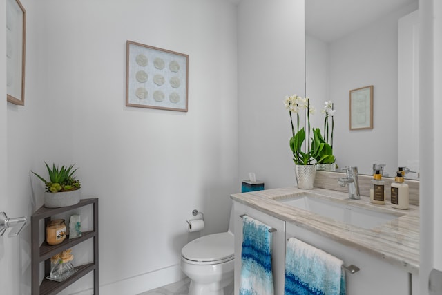 bathroom with tile patterned floors, vanity, and toilet