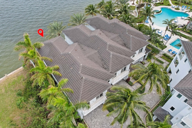 birds eye view of property with a water view