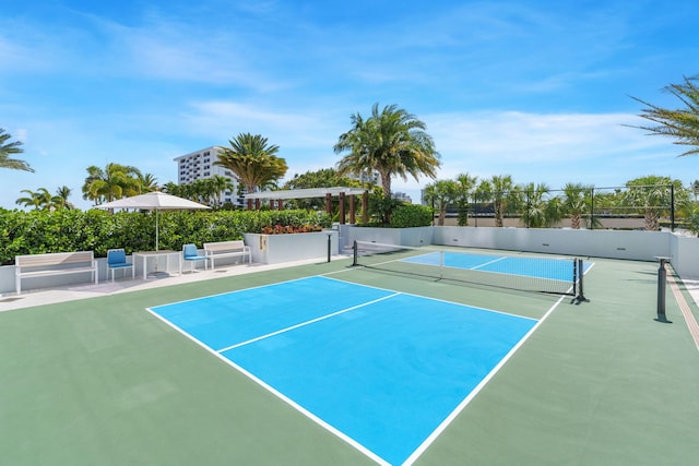 view of sport court featuring basketball hoop