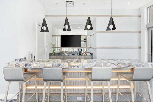 bar with decorative light fixtures