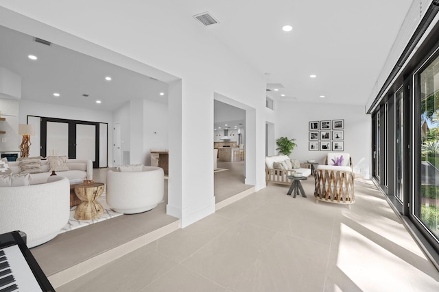 interior space featuring french doors and light tile patterned flooring