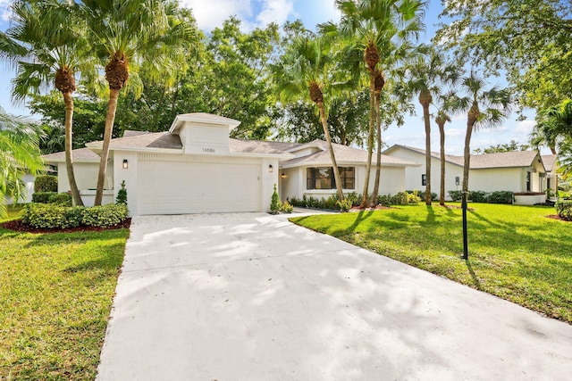 view of front facade featuring a garage and a front yard