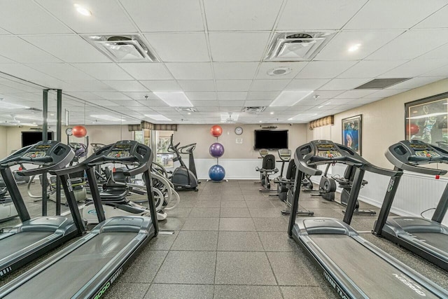 exercise room with a paneled ceiling