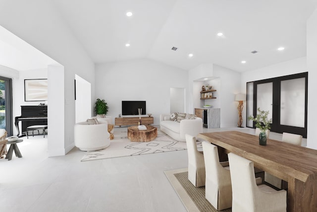 dining space with vaulted ceiling