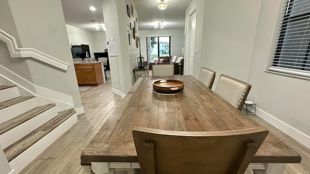 dining room with light hardwood / wood-style flooring