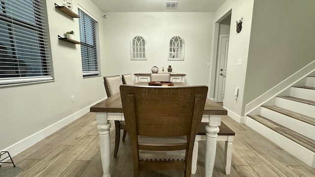 dining room with light hardwood / wood-style flooring