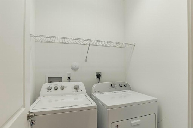 washroom featuring washing machine and dryer