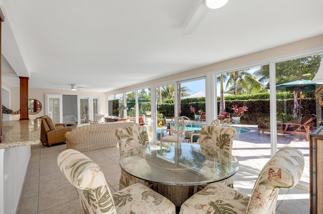 sunroom / solarium with ceiling fan