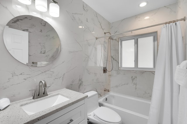 full bathroom with vanity, toilet, shower / bath combo with shower curtain, and tile walls