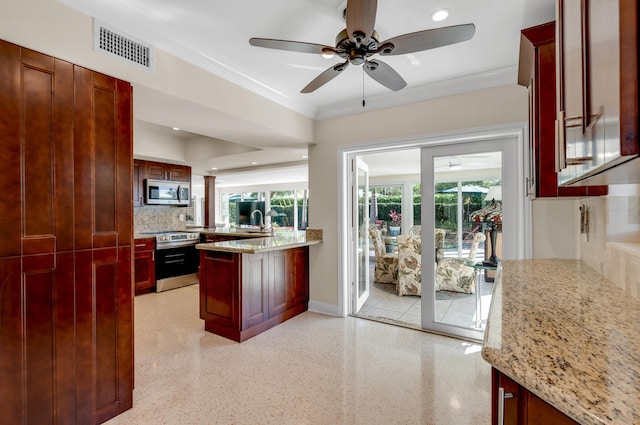 kitchen with light stone countertops, appliances with stainless steel finishes, tasteful backsplash, ceiling fan, and crown molding