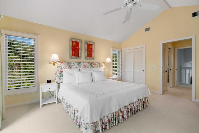 carpeted bedroom with ceiling fan, beam ceiling, and high vaulted ceiling