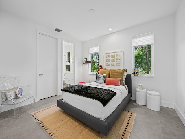 bedroom featuring connected bathroom