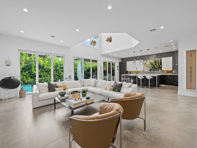 living room with a high ceiling