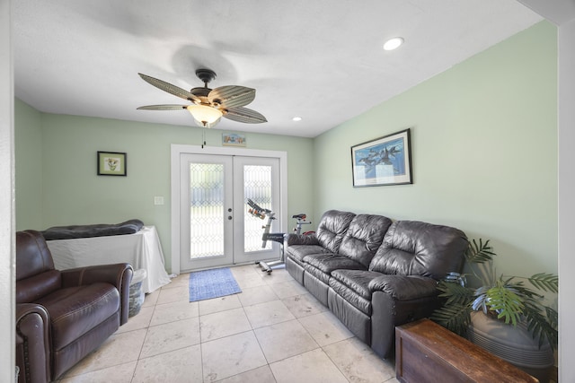 tiled living room with ceiling fan and french doors