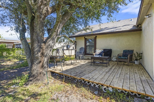 wooden deck featuring outdoor lounge area