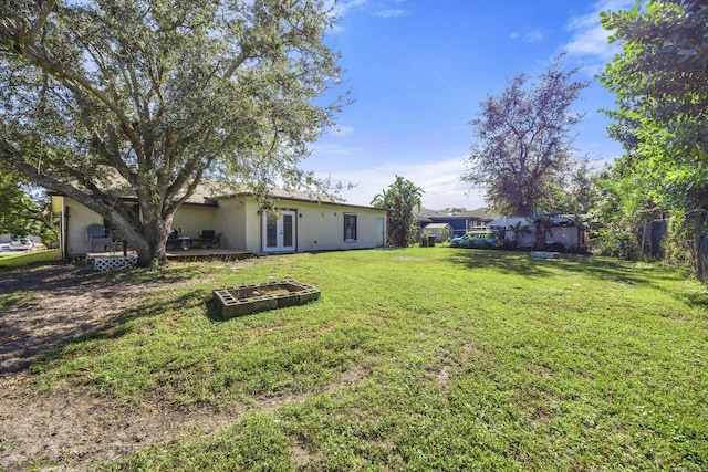 view of yard featuring french doors