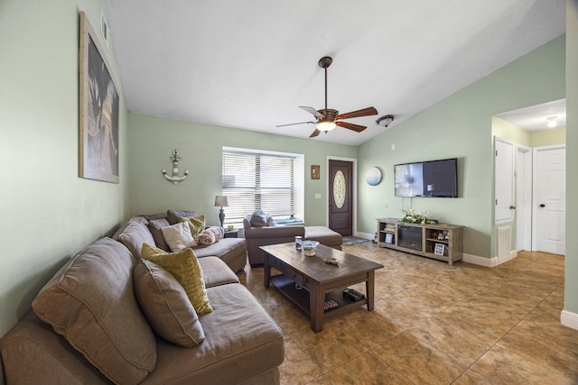 tiled living room featuring ceiling fan and lofted ceiling