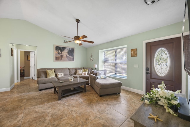 living room with ceiling fan, light tile patterned flooring, and vaulted ceiling