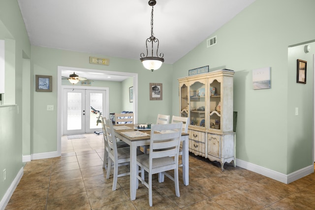 tiled dining area featuring french doors, vaulted ceiling, and ceiling fan