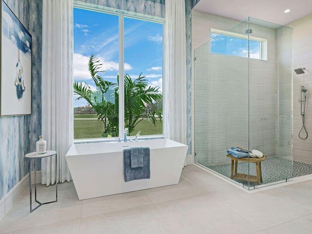 bathroom with tile patterned flooring and plus walk in shower