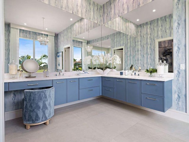 bathroom featuring vanity and a chandelier