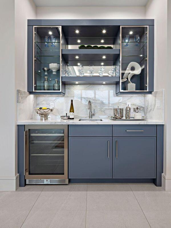 bar featuring light tile patterned floors, backsplash, wine cooler, and sink