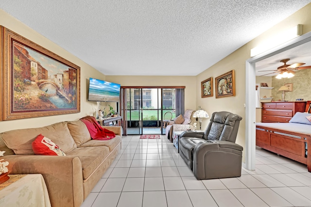 tiled living room with ceiling fan and a textured ceiling