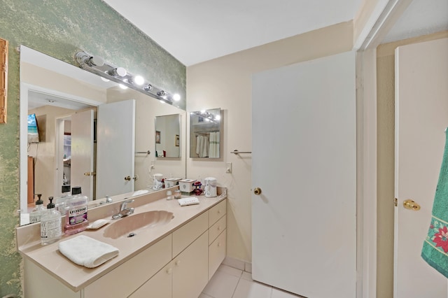 bathroom featuring tile patterned flooring and vanity