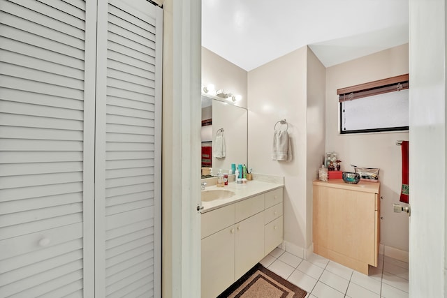 bathroom with tile patterned flooring and vanity