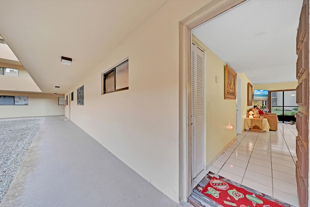 corridor with light tile patterned flooring