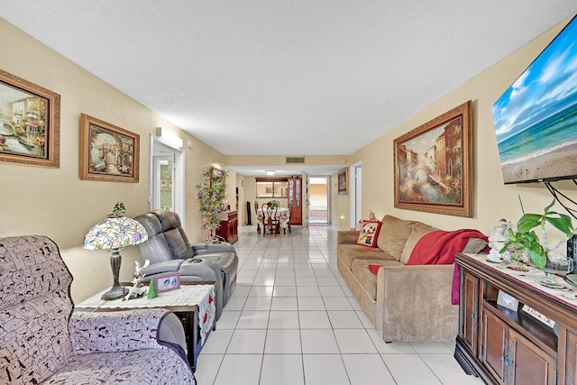 tiled living room with a textured ceiling