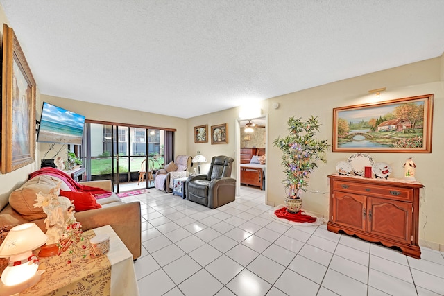 tiled living room with a textured ceiling and ceiling fan