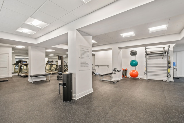 workout area with a drop ceiling