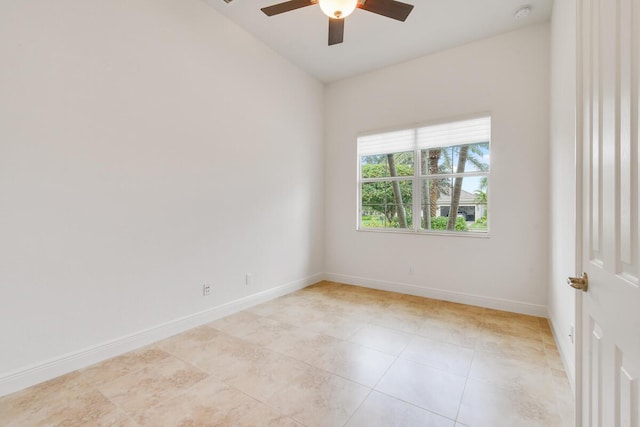 unfurnished room with ceiling fan and light tile patterned flooring